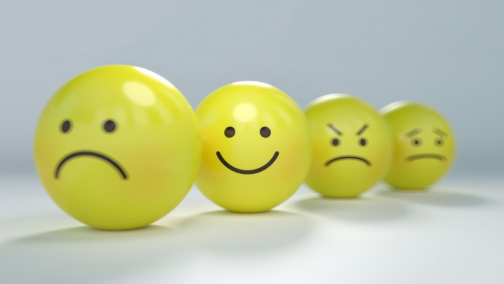 Emoticons als Kugeln mit fröhlichen, traurigen oder zornigen Gesichtsausdrücken