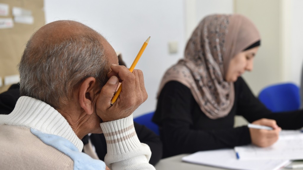 Foto: Zuwanderer aus verschiedenen Ländern nehmen an einem Integrationkurs teil