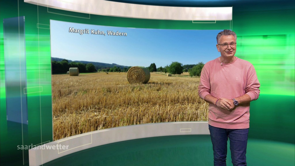 Foto: Michael Friemel im Wetterstudio vor einem Zuschauerbild