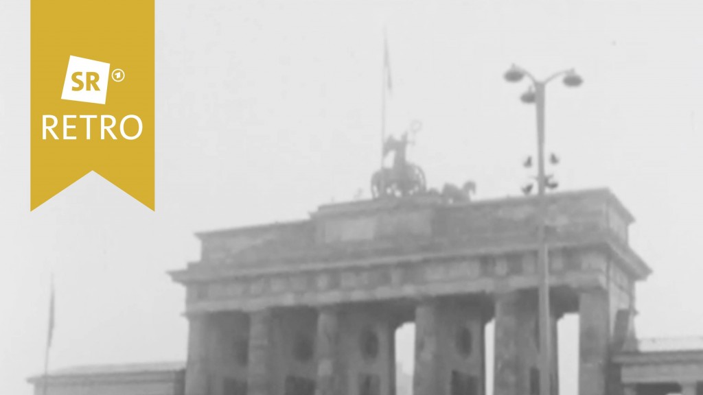 Berliner Mauer. Dahinter das Brandenburger Tor.