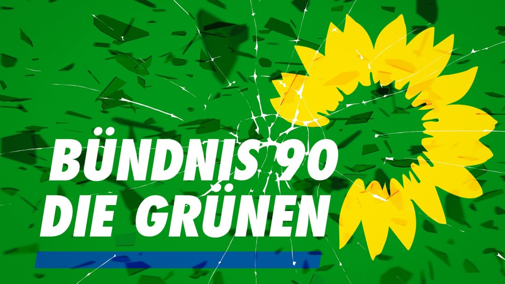 Logo der Partei Bündnis 90 Die Grünen in Scherben vor zerbrochenem Glas